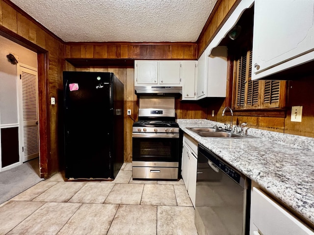 kitchen featuring stainless steel appliances, light countertops, white cabinetry, a sink, and under cabinet range hood