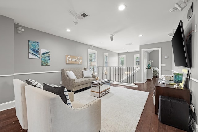 living room with dark hardwood / wood-style floors