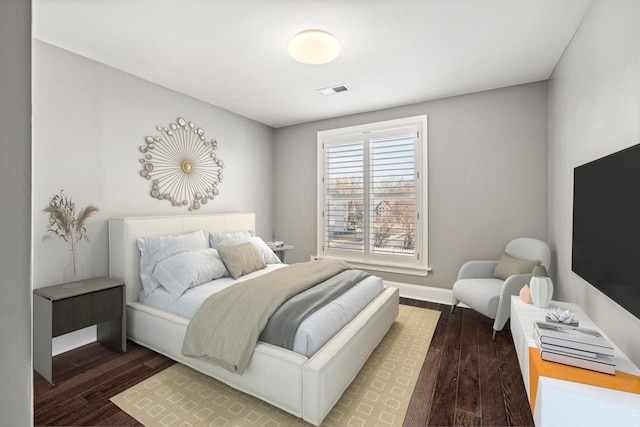 bedroom featuring dark hardwood / wood-style flooring