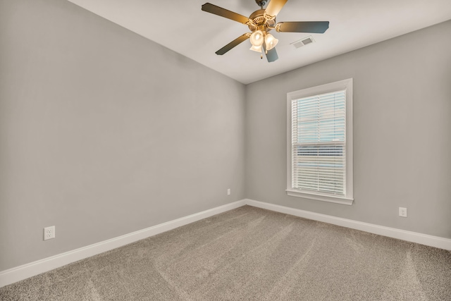 empty room featuring ceiling fan and carpet floors