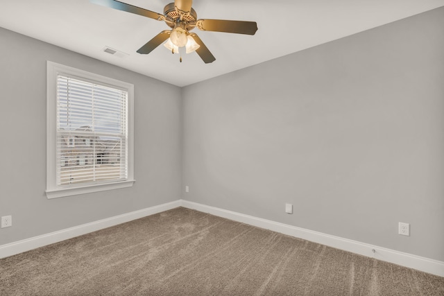 carpeted empty room with ceiling fan