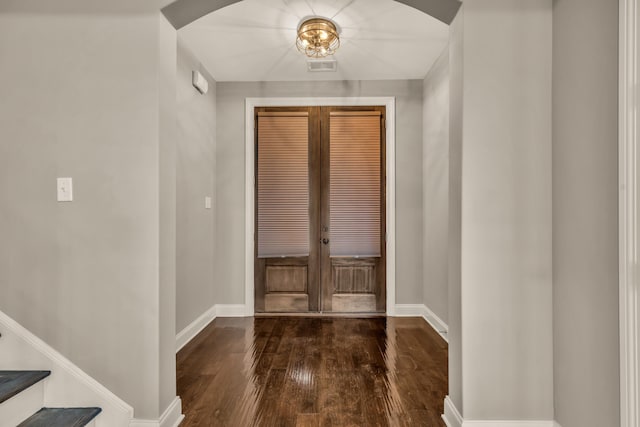 foyer entrance featuring dark hardwood / wood-style flooring