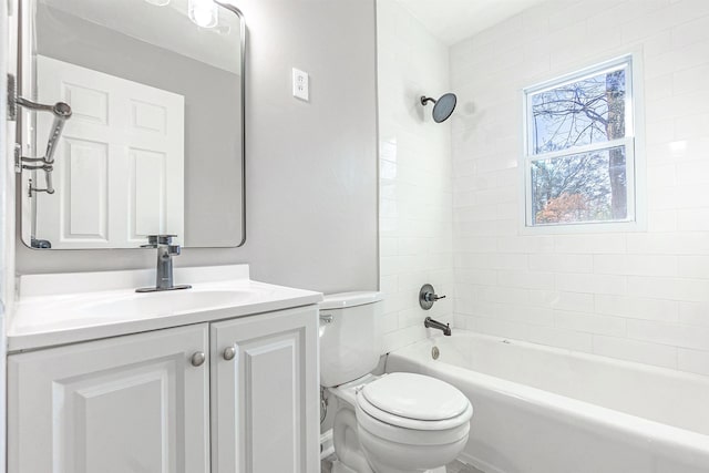 full bathroom with vanity, toilet, and tiled shower / bath