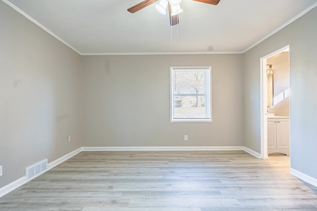 spare room with ceiling fan, light hardwood / wood-style flooring, and ornamental molding