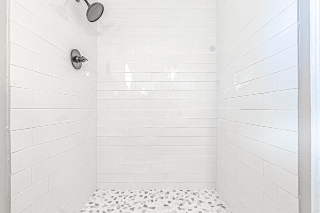 bathroom with tiled shower