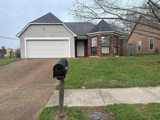 view of front of house featuring a front yard and a garage