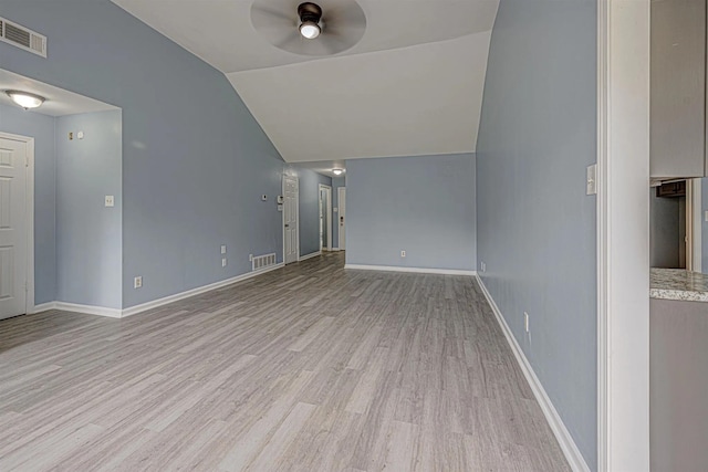 unfurnished living room with ceiling fan, lofted ceiling, and light hardwood / wood-style flooring