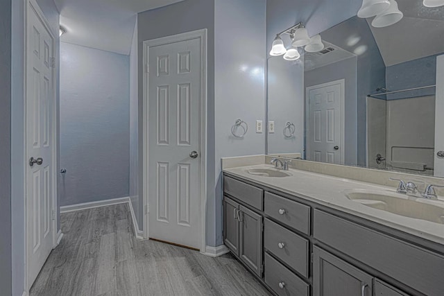 bathroom featuring vanity and hardwood / wood-style flooring