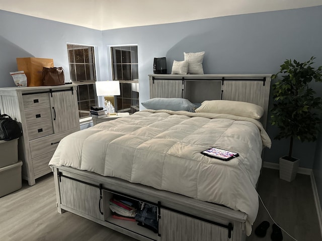 bedroom featuring light hardwood / wood-style flooring