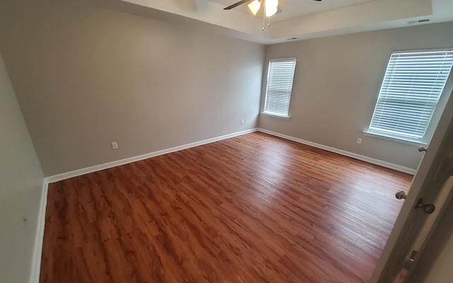 unfurnished room with hardwood / wood-style floors and ceiling fan