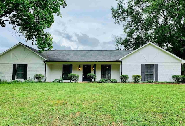 ranch-style home with a front lawn