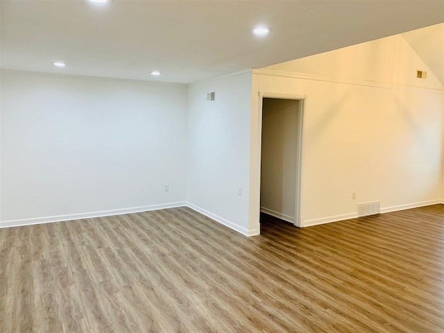 spare room with hardwood / wood-style floors