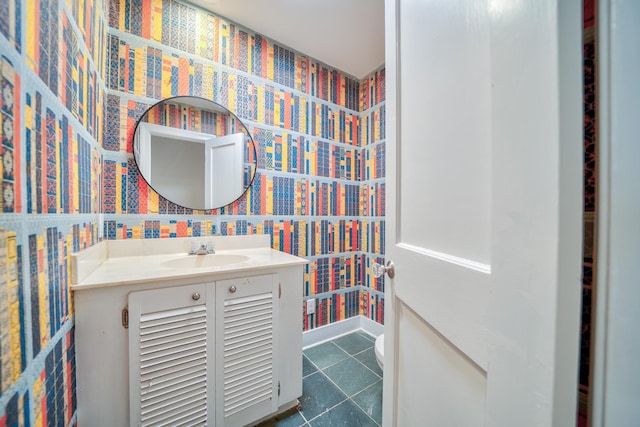 bathroom featuring tile patterned floors, vanity, and toilet