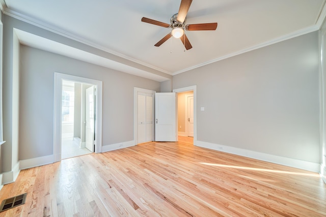 empty room featuring crown molding, ceiling fan, and light wood-type flooring