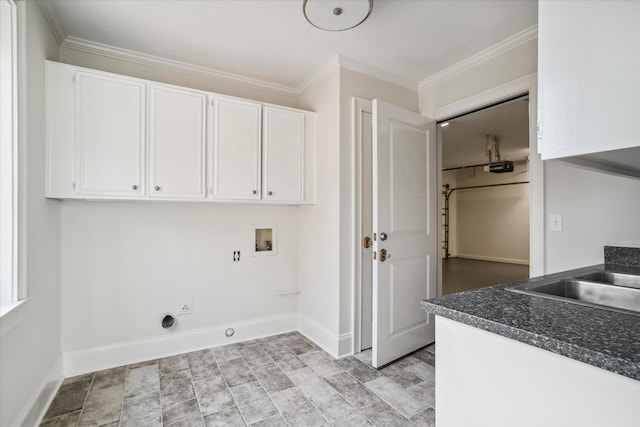 laundry room featuring electric dryer hookup, cabinets, washer hookup, ornamental molding, and light hardwood / wood-style floors