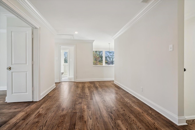 empty room with dark hardwood / wood-style floors and crown molding