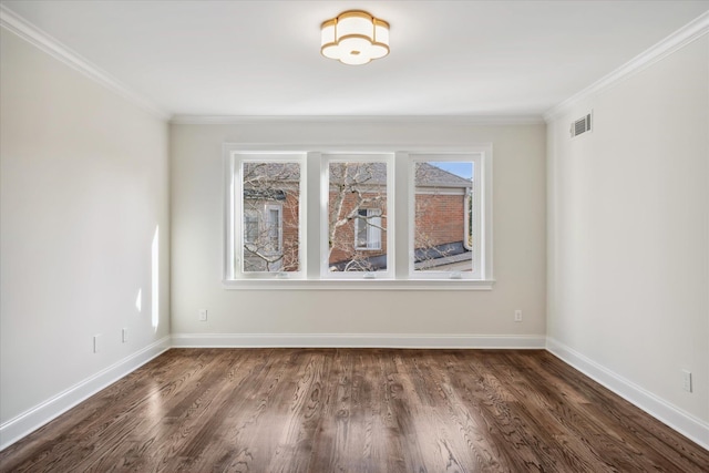 spare room with dark hardwood / wood-style floors and crown molding