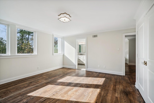 empty room with dark hardwood / wood-style flooring