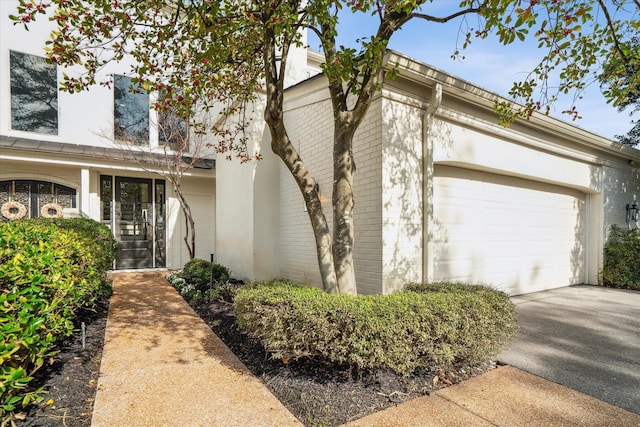 view of property exterior with a garage