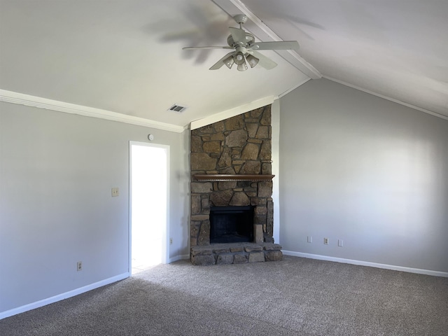 unfurnished living room featuring carpet flooring, ceiling fan, a stone fireplace, lofted ceiling with beams, and crown molding