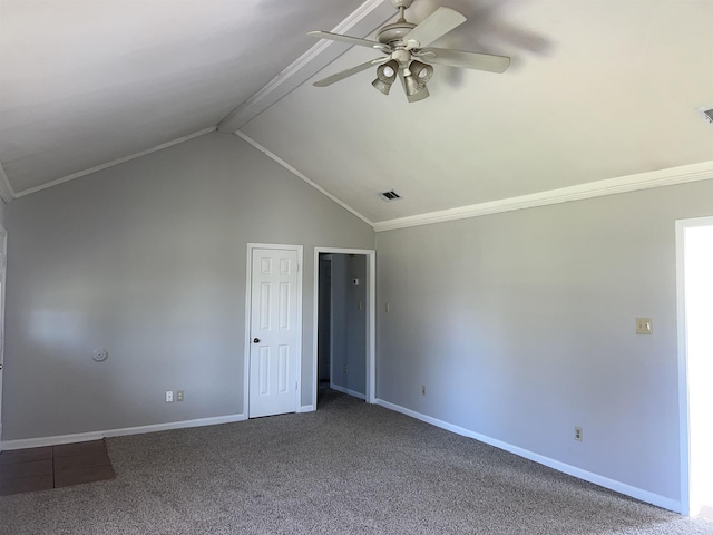 carpeted spare room with ceiling fan, crown molding, and vaulted ceiling