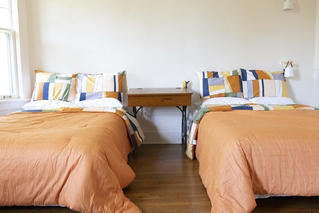 bedroom featuring dark hardwood / wood-style flooring