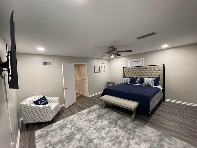 bedroom featuring ceiling fan and dark hardwood / wood-style floors