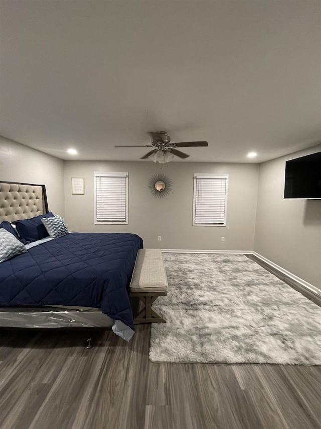 bedroom featuring ceiling fan and dark hardwood / wood-style flooring