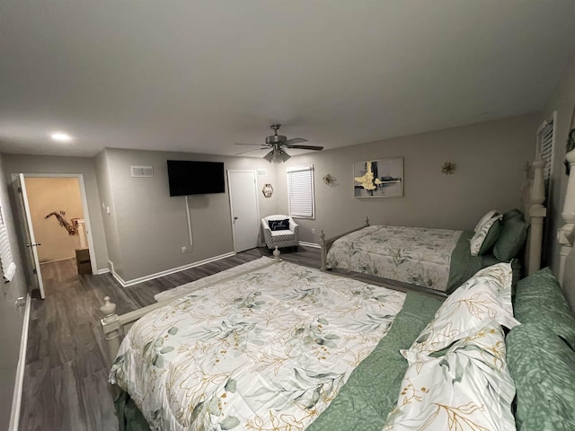 bedroom featuring ceiling fan, a closet, and dark hardwood / wood-style floors