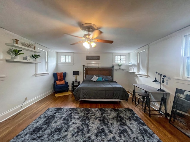 bedroom featuring ceiling fan and dark wood-type flooring