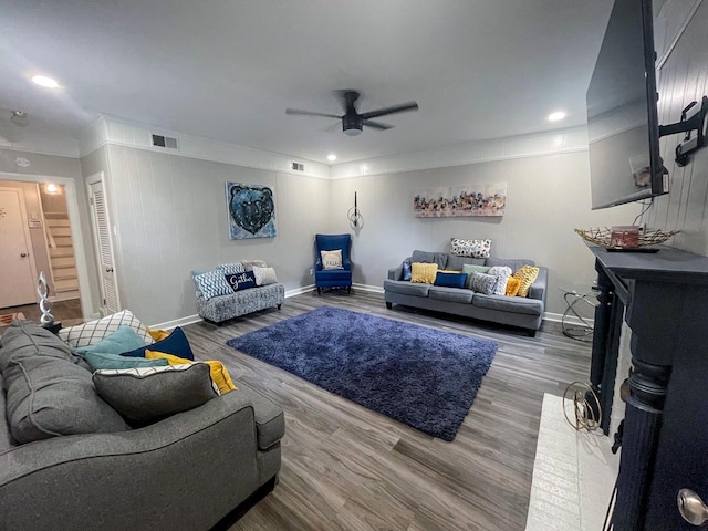 living room featuring hardwood / wood-style flooring and ceiling fan