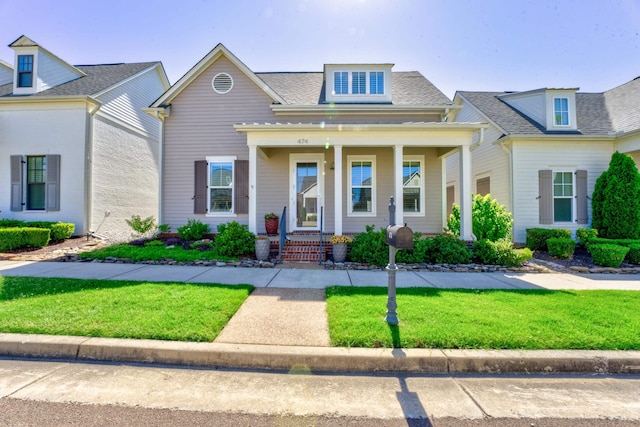 474 S Shea Rd, Collierville, TN 38017 - view of front of house featuring a porch, a front lawn, and roof with shingles