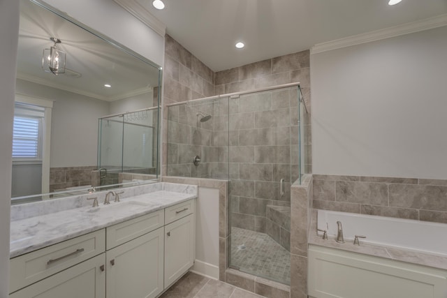 bathroom featuring tile patterned floors, crown molding, vanity, and shower with separate bathtub