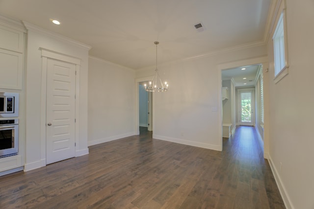 unfurnished dining area featuring dark hardwood / wood-style floors, an inviting chandelier, and crown molding