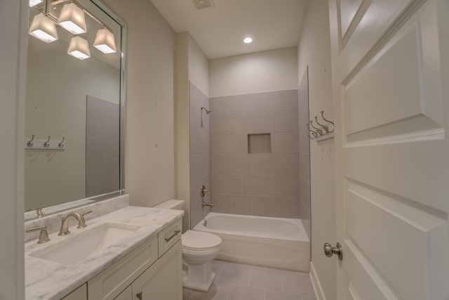 full bathroom with tile patterned floors, vanity, toilet, and tiled shower / bath