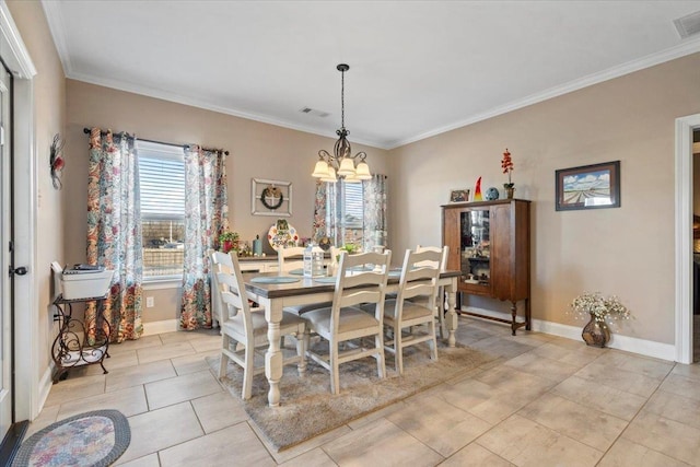 dining area featuring light tile patterned floors, a chandelier, and ornamental molding