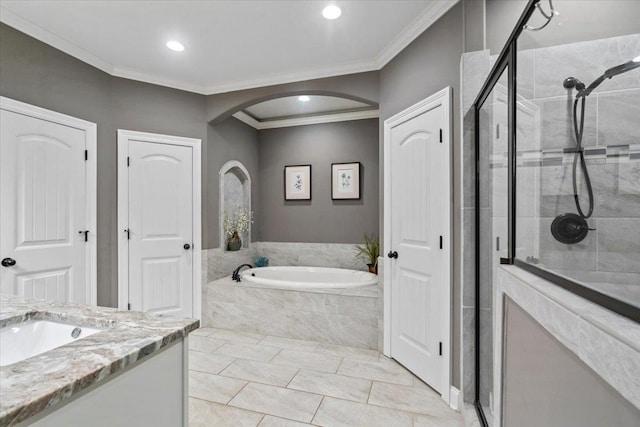 bathroom featuring tile patterned floors, vanity, ornamental molding, and independent shower and bath