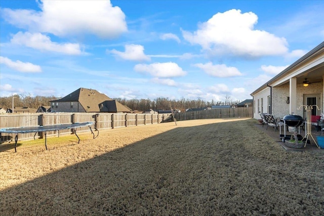 view of yard featuring a trampoline