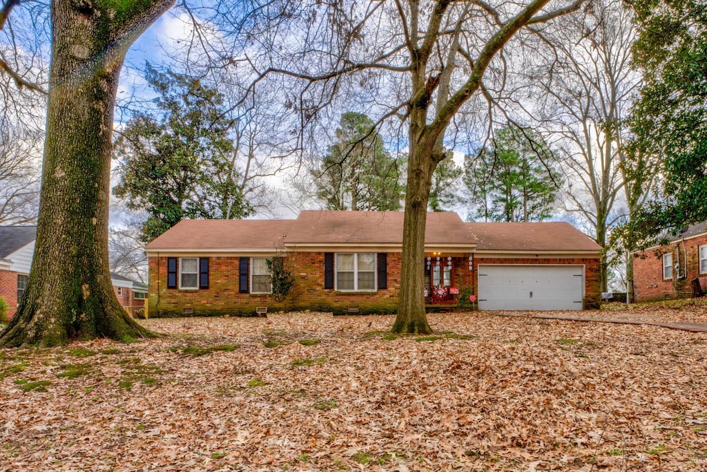 single story home with a garage