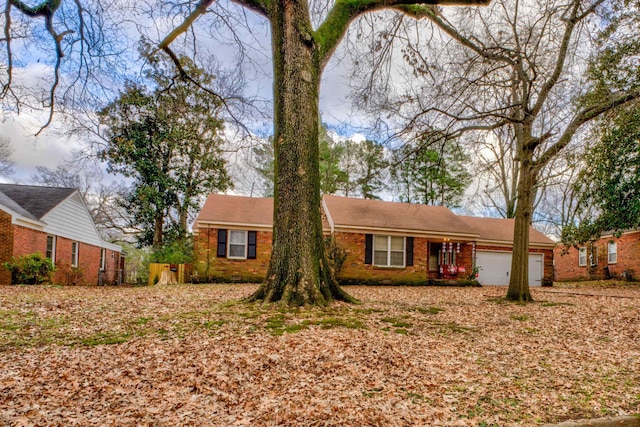 single story home with a garage