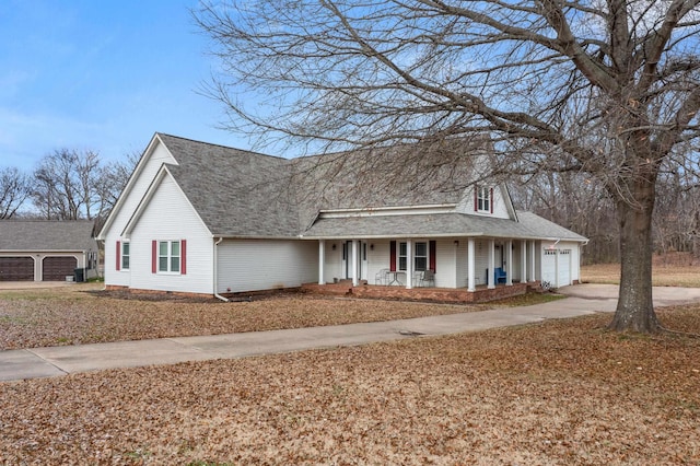 view of front facade featuring a porch and a garage