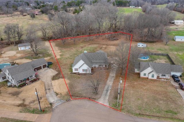 birds eye view of property featuring a rural view