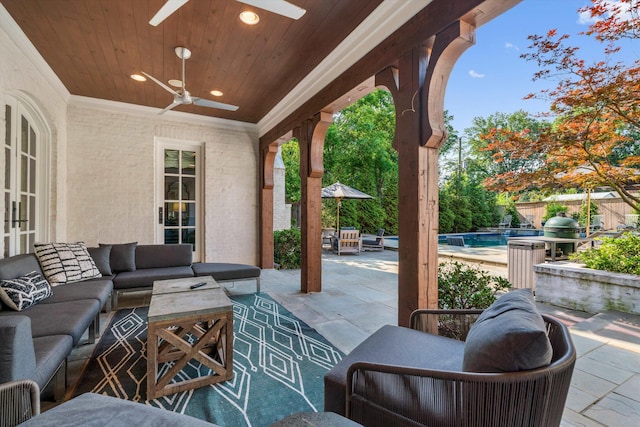 view of patio featuring ceiling fan and an outdoor living space