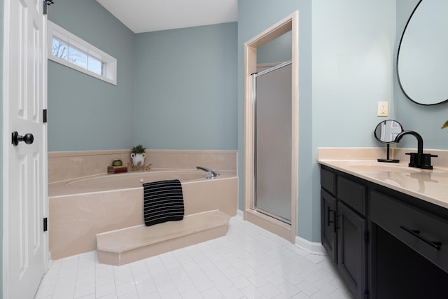 bathroom featuring tile patterned flooring, shower with separate bathtub, and vanity