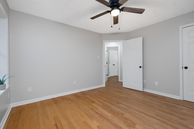 unfurnished bedroom with ceiling fan and light hardwood / wood-style floors