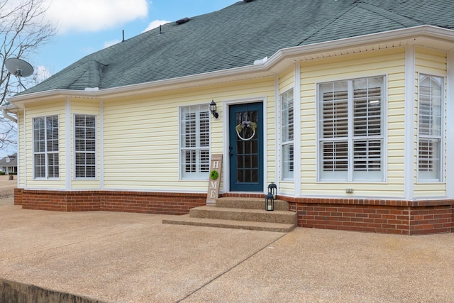 doorway to property with a patio