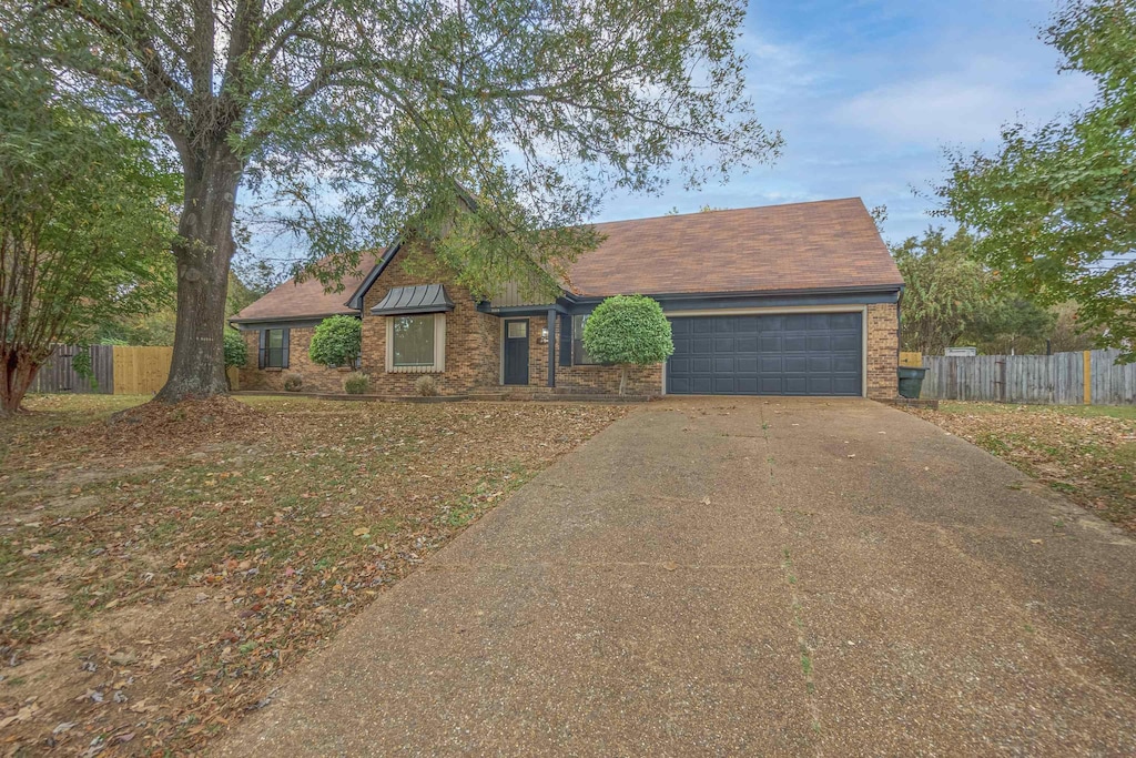 view of front of property with a garage