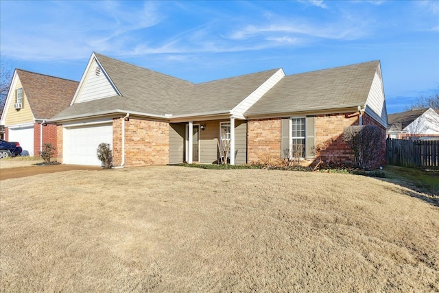 ranch-style home featuring a garage and a front yard