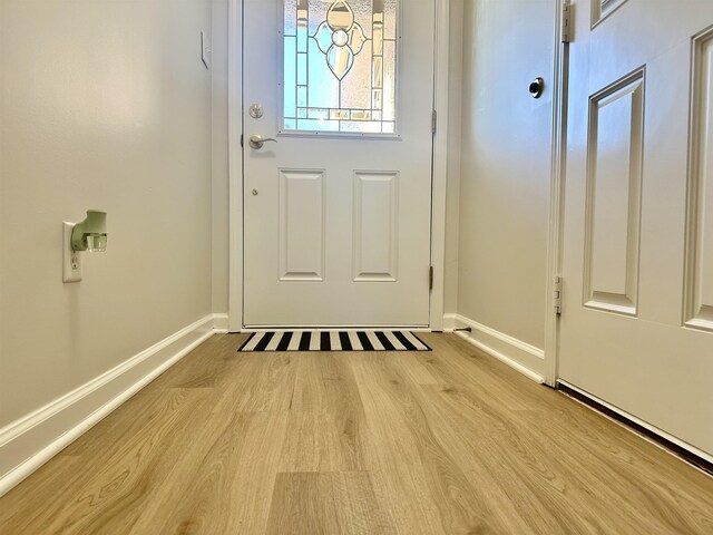 entryway with light hardwood / wood-style flooring