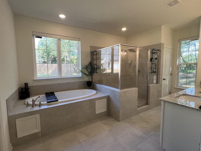 bathroom with vanity, tile patterned floors, and independent shower and bath